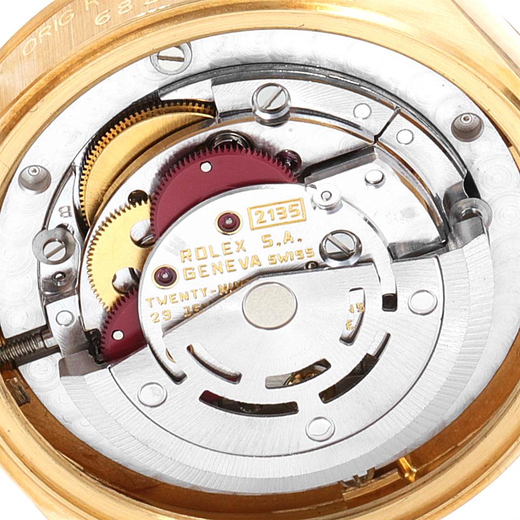 This is a close-up view of the Rolex President 68278 Women's Yellow Gold Silver Dial 68278 Women's Yellow Gold Silver Dial model, showing the intricate inner mechanical parts of the watch.