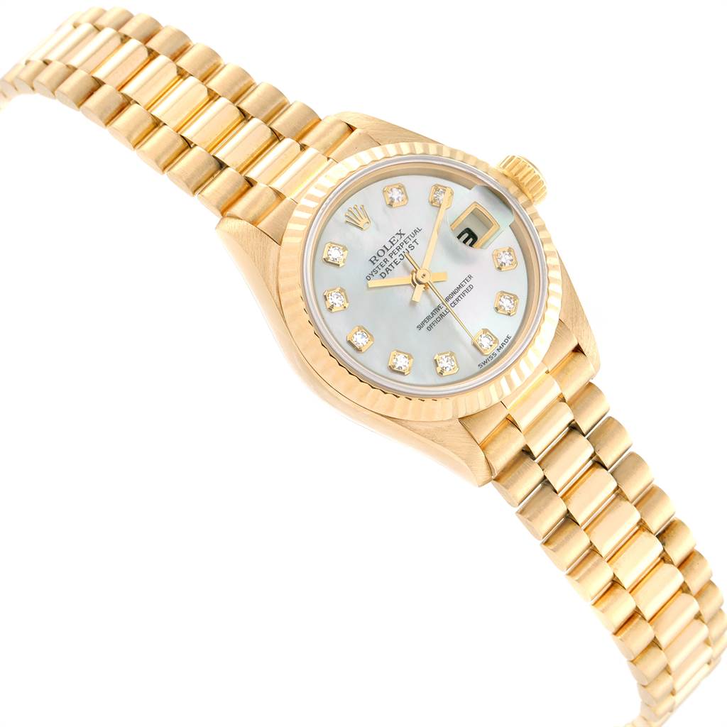 The image shows a Rolex President 79178 Women
s Yellow Gold Mother of Pearl Dial 79178 Women
s Yellow Gold Mother of Pearl Dial model watch at a slight angle, displaying the bracelet, crown, and diamond-studded dial.