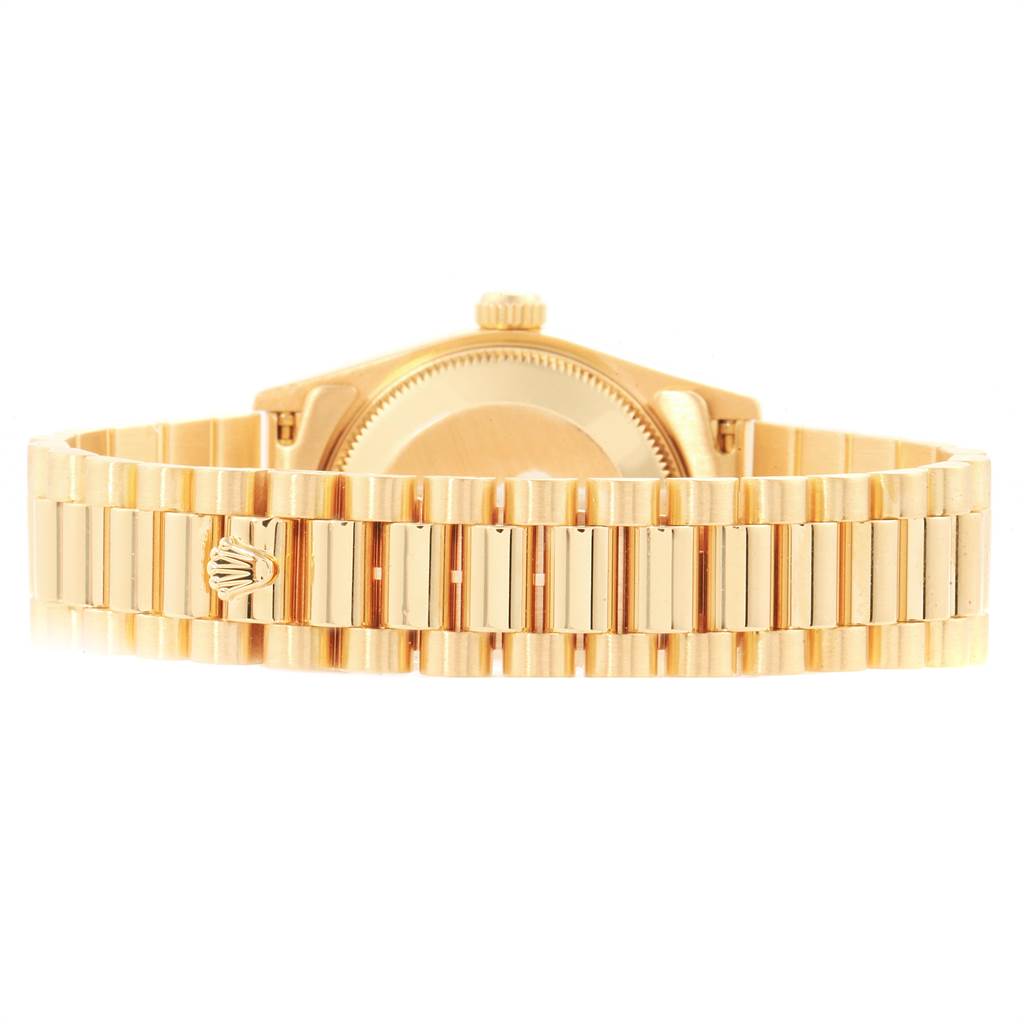 This image shows the back and bracelet of a Rolex President 68278 Women
s Yellow Gold Champagne Dial 68278 Women
s Yellow Gold Champagne Dial model watch, featuring its signature gold design.