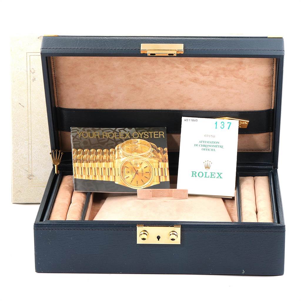 The image shows a Rolex President 69158 Women's Yellow Gold Blue Dial 69158 Women's Yellow Gold Blue Dial model box, including the certificate and booklet, at a straight-on angle.