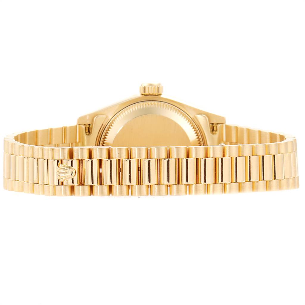 The image shows the back of a Rolex President 69158 Women's Yellow Gold Blue Dial 69158 Women's Yellow Gold Blue Dial model watch, highlighting the bracelet and case back.