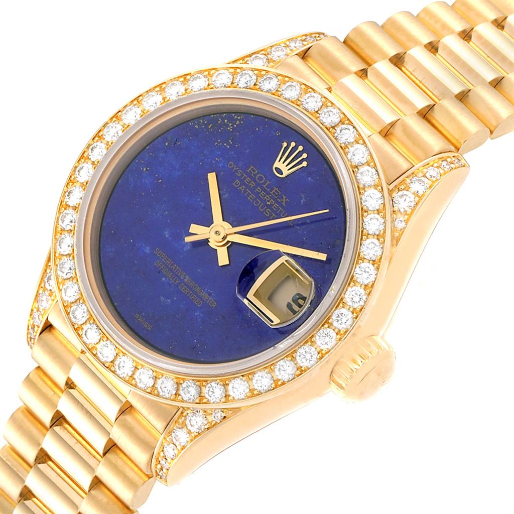 This image shows a close-up of the Rolex President 69158 Women's Yellow Gold Blue Dial 69158 Women's Yellow Gold Blue Dial model watch, featuring a blue dial, diamond bezel, and gold bracelet.