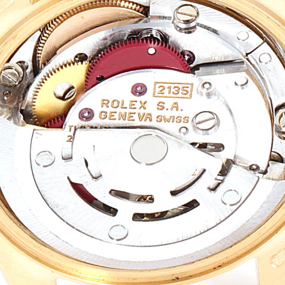 This image shows the inner mechanical movement of a Rolex President 69158 Women's Yellow Gold Blue Dial 69158 Women's Yellow Gold Blue Dial model watch, focusing on its intricate components.