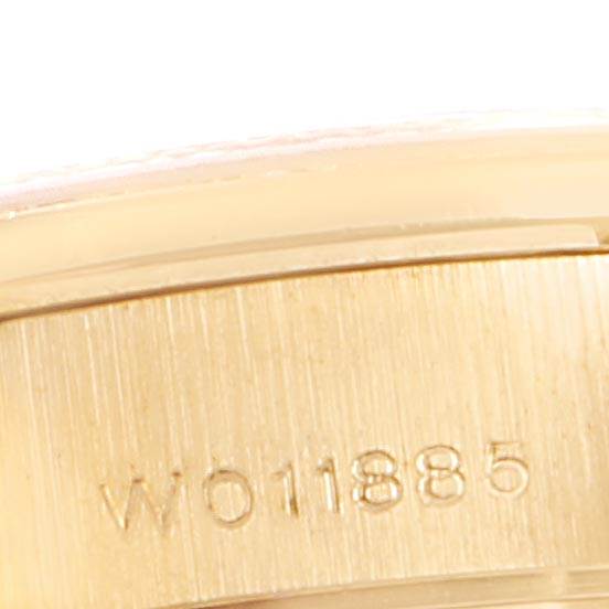 This image shows a close-up of the Rolex President 69158 Women's Yellow Gold Blue Dial 69158 Women's Yellow Gold Blue Dial watch's side, highlighting its serial number engraving.