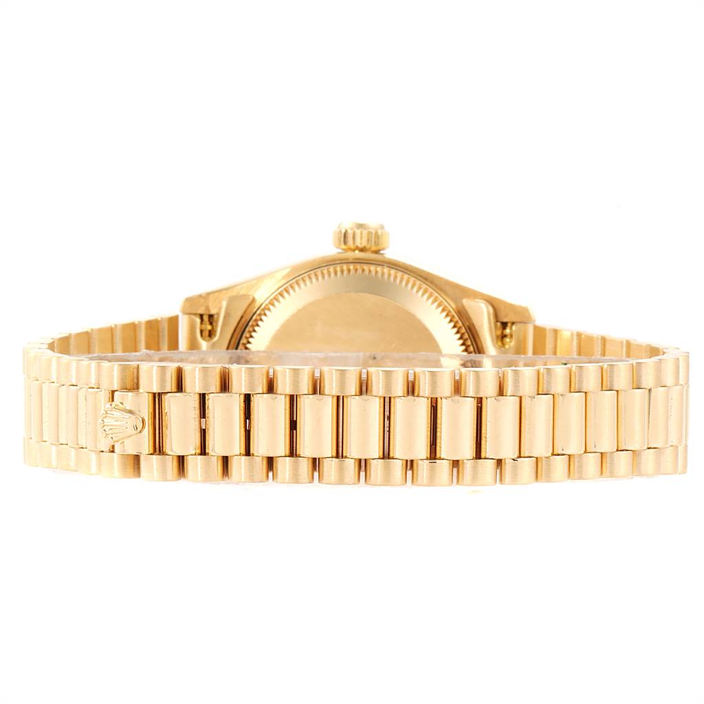 The image shows a rear view of a Rolex President 69178 Women
s Yellow Gold White Dial 69178 Women
s Yellow Gold White Dial model watch, focusing on the gold bracelet and case back.