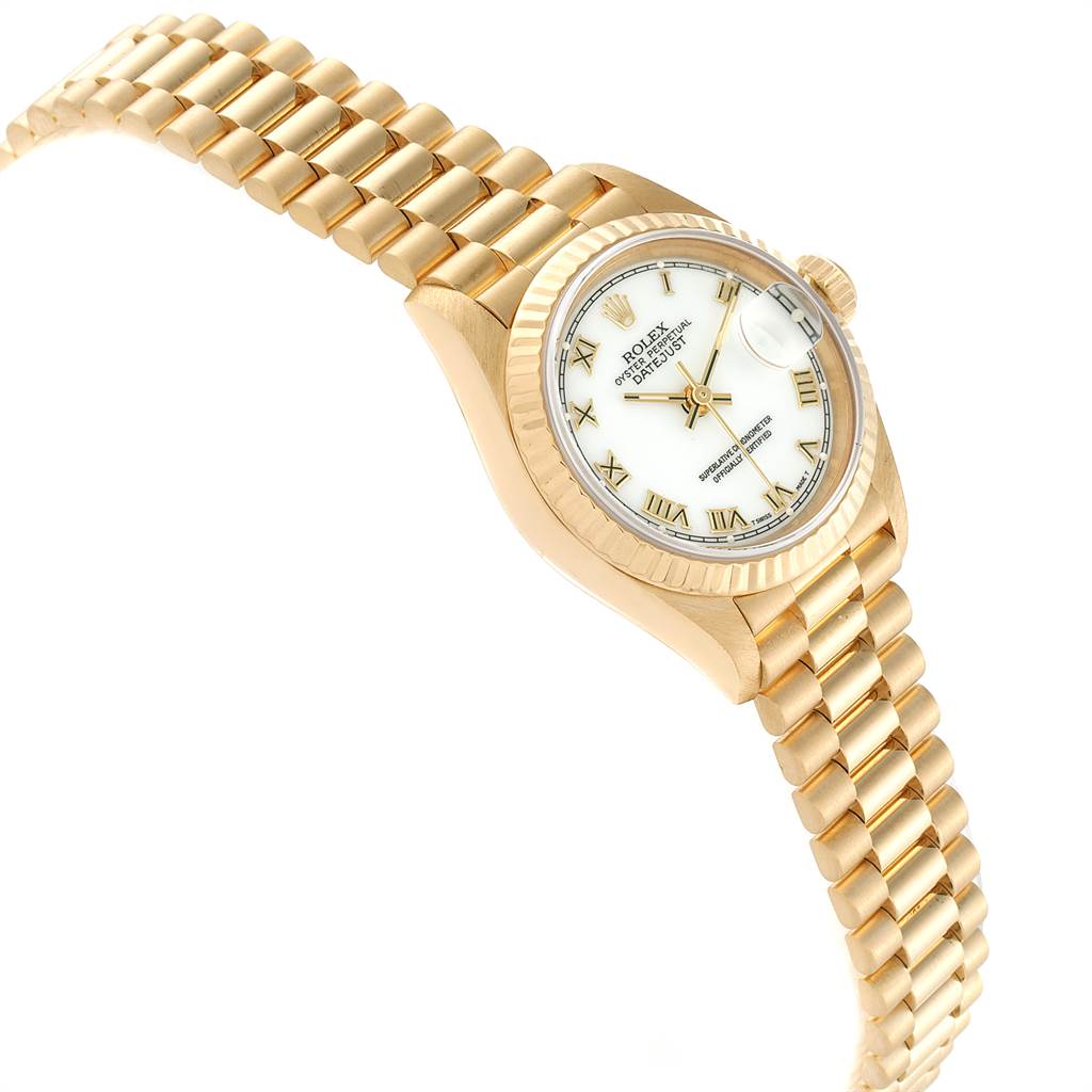 This image shows a Rolex President 69178 Women
s Yellow Gold White Dial 69178 Women
s Yellow Gold White Dial model watch from a top-side angle, highlighting its gold bracelet and white dial with Roman numerals.