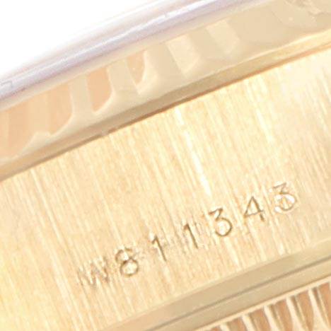 The image shows a close-up of the band and serial number of a Rolex President 69178 Women
s Yellow Gold White Dial 69178 Women
s Yellow Gold White Dial model watch.