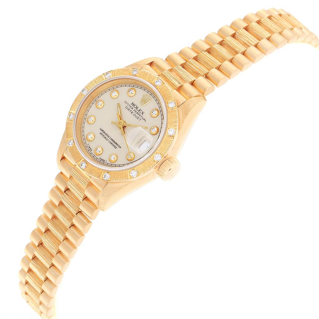 The image shows a gold Rolex President 69288 Women's Yellow Gold Beige Dial 69288 Women's Yellow Gold Beige Dial model watch from an oblique angle, displaying the dial, bezel, and part of the bracelet.