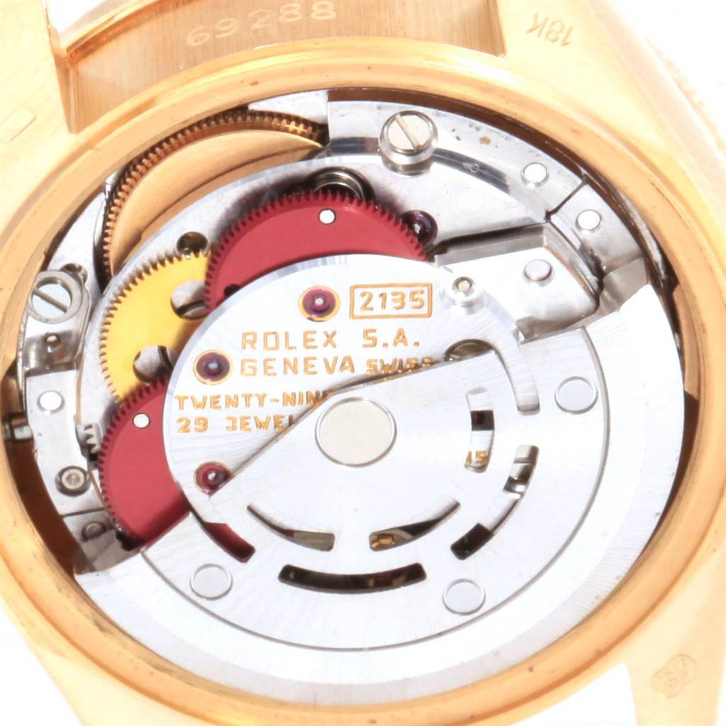 The image shows the inner mechanism of the Rolex President 69288 Women's Yellow Gold Beige Dial 69288 Women's Yellow Gold Beige Dial model watch, highlighting the movement and gears.