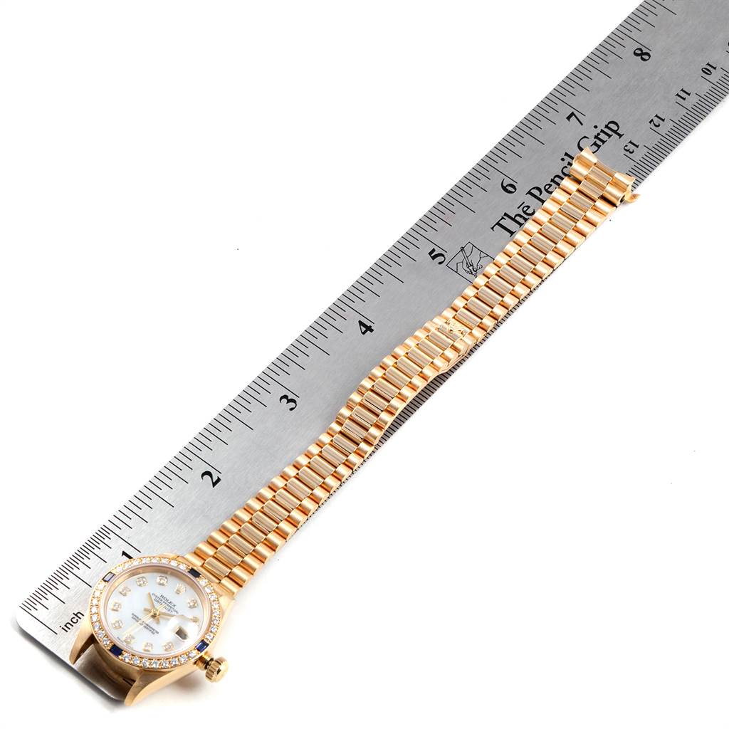 The Rolex President 69088 Women's Yellow Gold Mother of Pearl Dial 69088 Women's Yellow Gold Mother of Pearl Dial model watch is shown from above, displaying its full bracelet and dial.