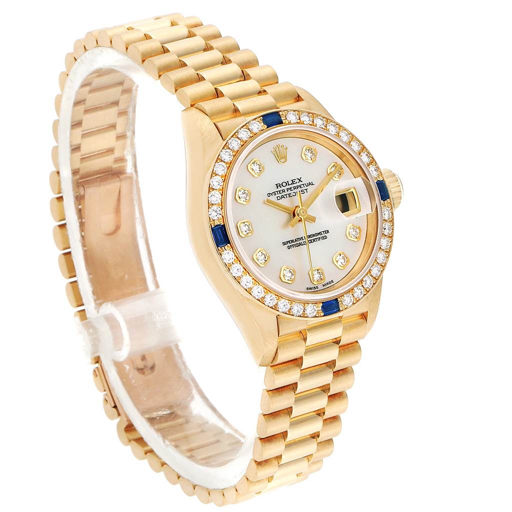 The image shows a side-angle view of the Rolex President 69088 Women's Yellow Gold Mother of Pearl Dial 69088 Women's Yellow Gold Mother of Pearl Dial model watch, highlighting its bracelet, dial, and gem-encrusted bezel.
