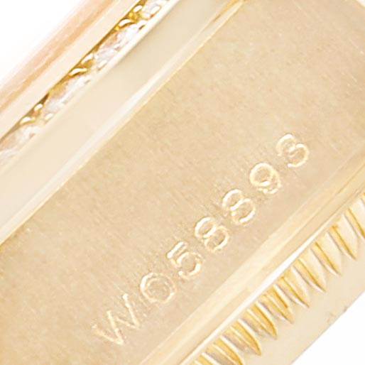 This close-up image shows the serial number engraving on the side of a Rolex President 69138 Women's Yellow Gold Silver Dial 69138 Women's Yellow Gold Silver Dial model watch.
