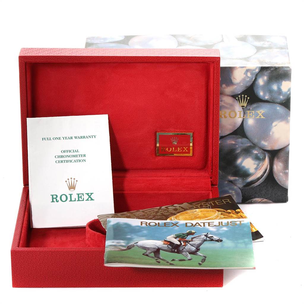 The image shows the open box with booklets and warranty paperwork for a Rolex President 69138 Women's Yellow Gold Silver Dial 69138 Women's Yellow Gold Silver Dial model watch.