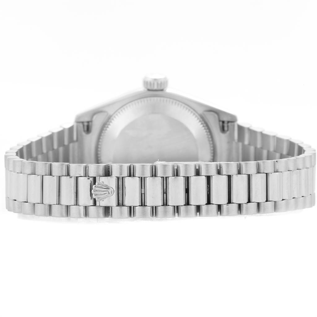 The image shows the back view of a Rolex President 69179 Women's White Gold Silver Dial 69179 Women's White Gold Silver Dial model watch, highlighting the bracelet and the case back.