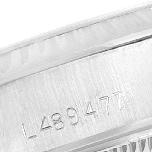 This close-up image shows the serial number engraved on the side of the bezel and case of a Rolex President 69179 Women's White Gold Silver Dial 69179 Women's White Gold Silver Dial model watch.