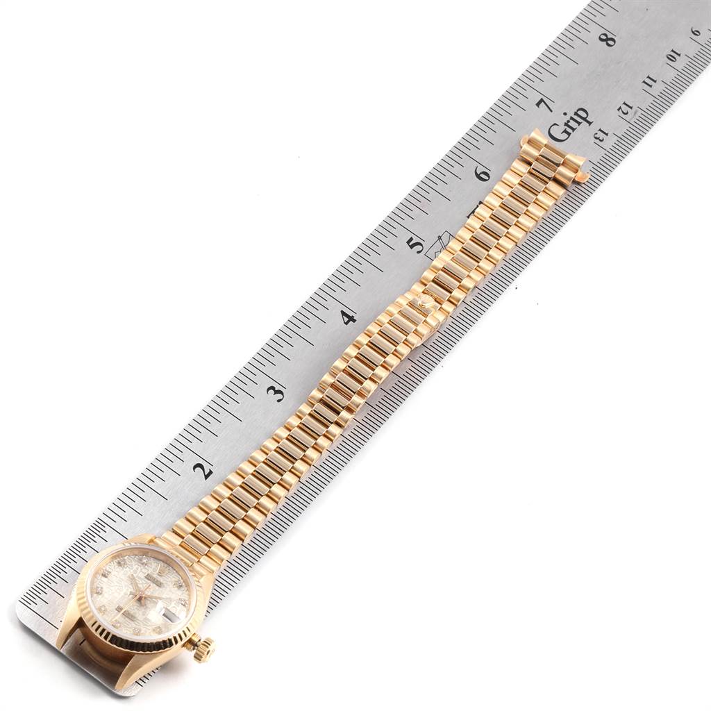 The image shows a Rolex President 69178 Women's Yellow Gold Silver Dial 69178 Women's Yellow Gold Silver Dial model watch, including the face, bracelet, and a measuring ruler for scale at an overhead angle.
