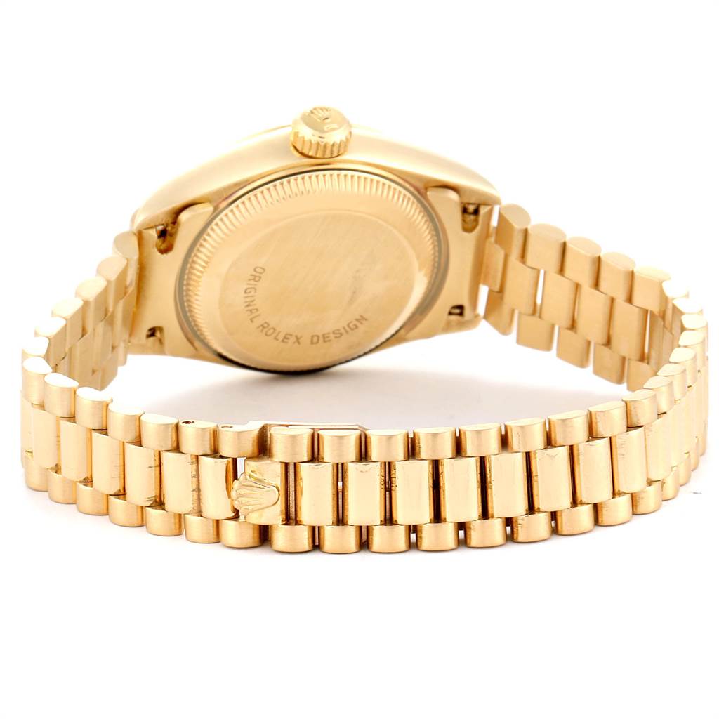 This image shows the back view of a Rolex President 69178 Women's Yellow Gold Silver Dial 69178 Women's Yellow Gold Silver Dial watch, focusing on the case back and its gold bracelet.