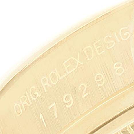 This close-up image shows the engraved serial number on the inner bezel of a Rolex President 179298 Women
s Yellow Gold Champagne Dial 179298 Women
s Yellow Gold Champagne Dial model watch.