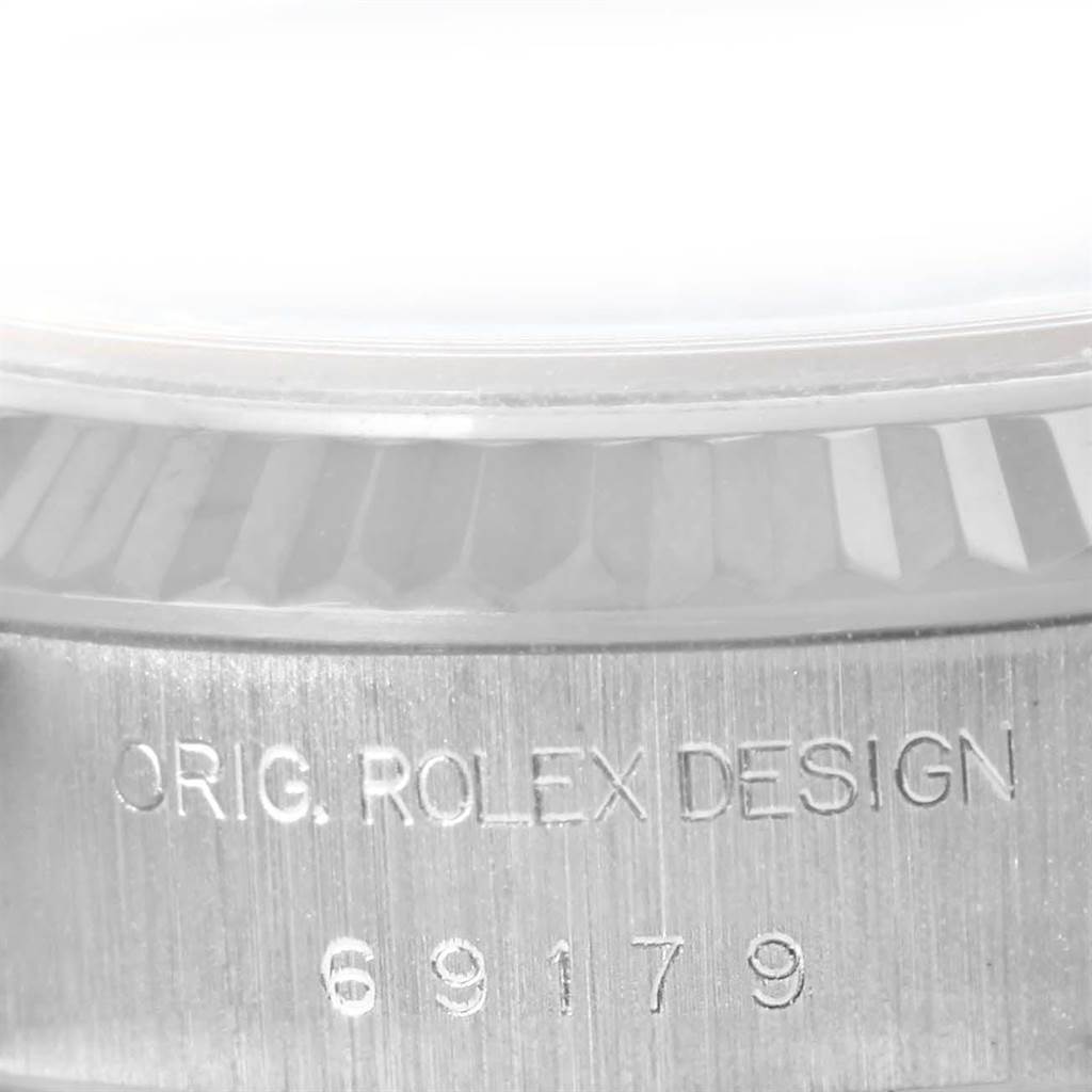 This image shows a close-up of the side engraving and part of the bezel of a Rolex President 69179 Women's White Gold Silver Dial 69179 Women's White Gold Silver Dial watch, displaying the model number 69179.