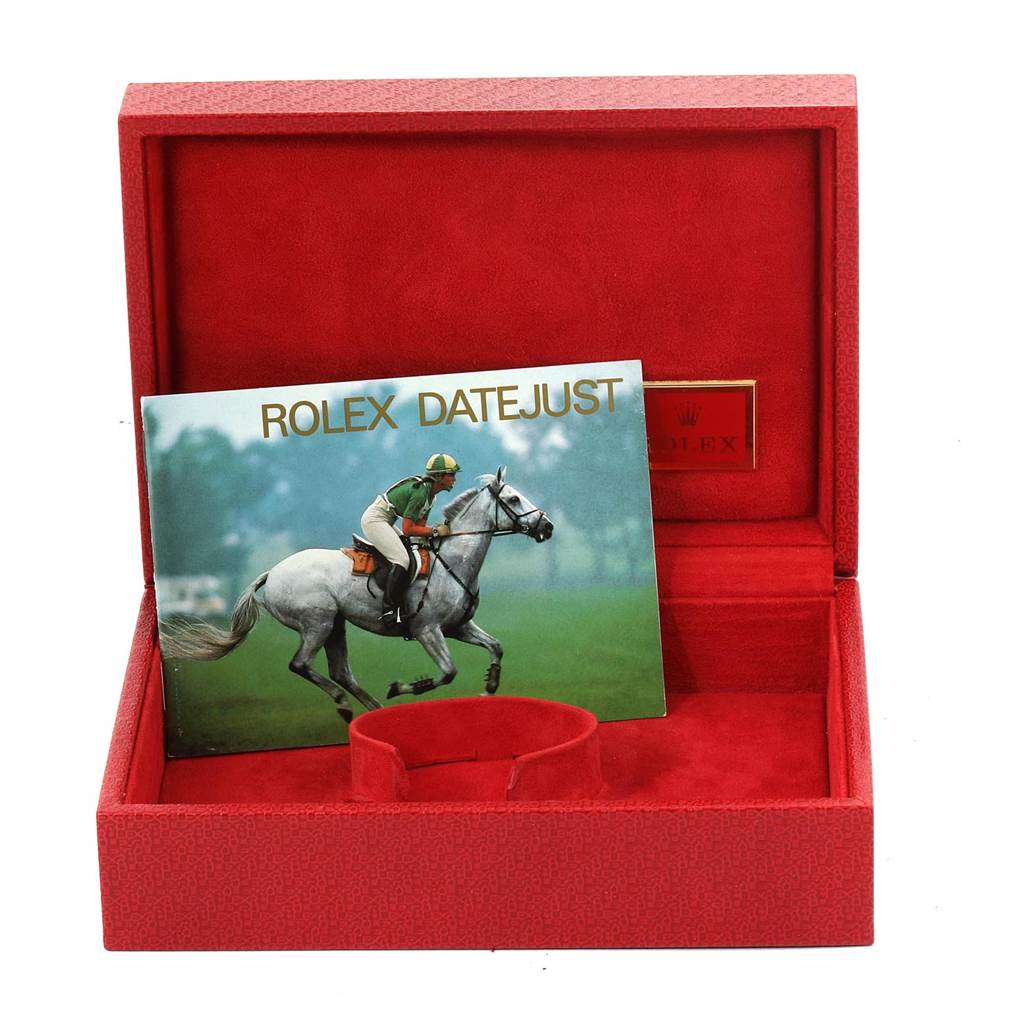 The image shows a red Rolex box for the President model with a Rolex Datejust pamphlet inside.