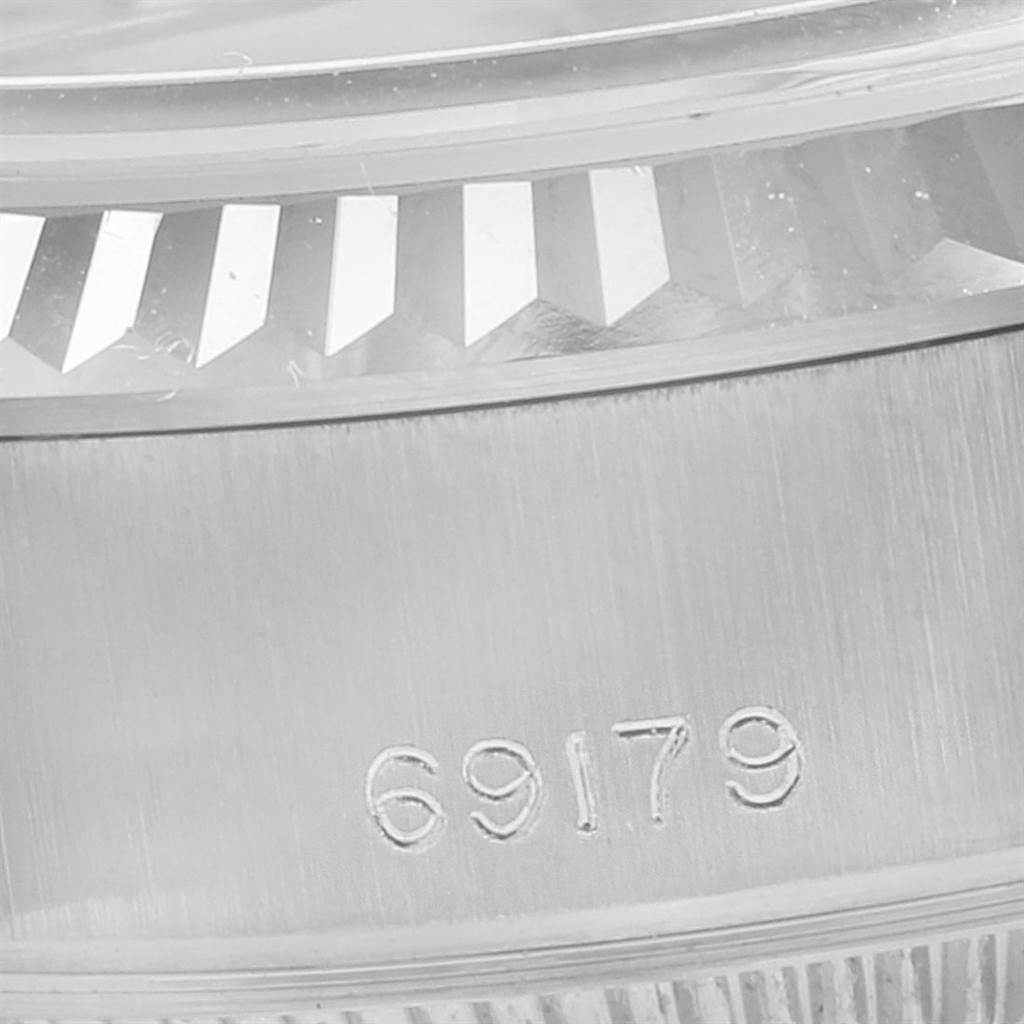 This is a close-up of the casing and bezel of a Rolex President 69179 Women's White Gold Silver Dial 69179 Women's White Gold Silver Dial model watch, with the reference number 69179 visible.