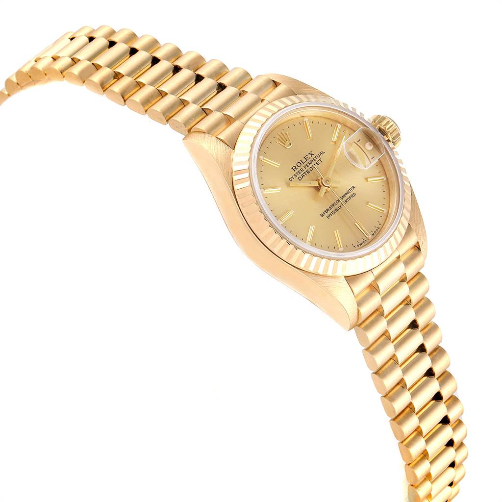 The image shows a side angle of a Rolex President 69178 Women
s Yellow Gold Champagne Dial 69178 Women
s Yellow Gold Champagne Dial model watch, highlighting the gold bracelet, case, and a portion of the dial.