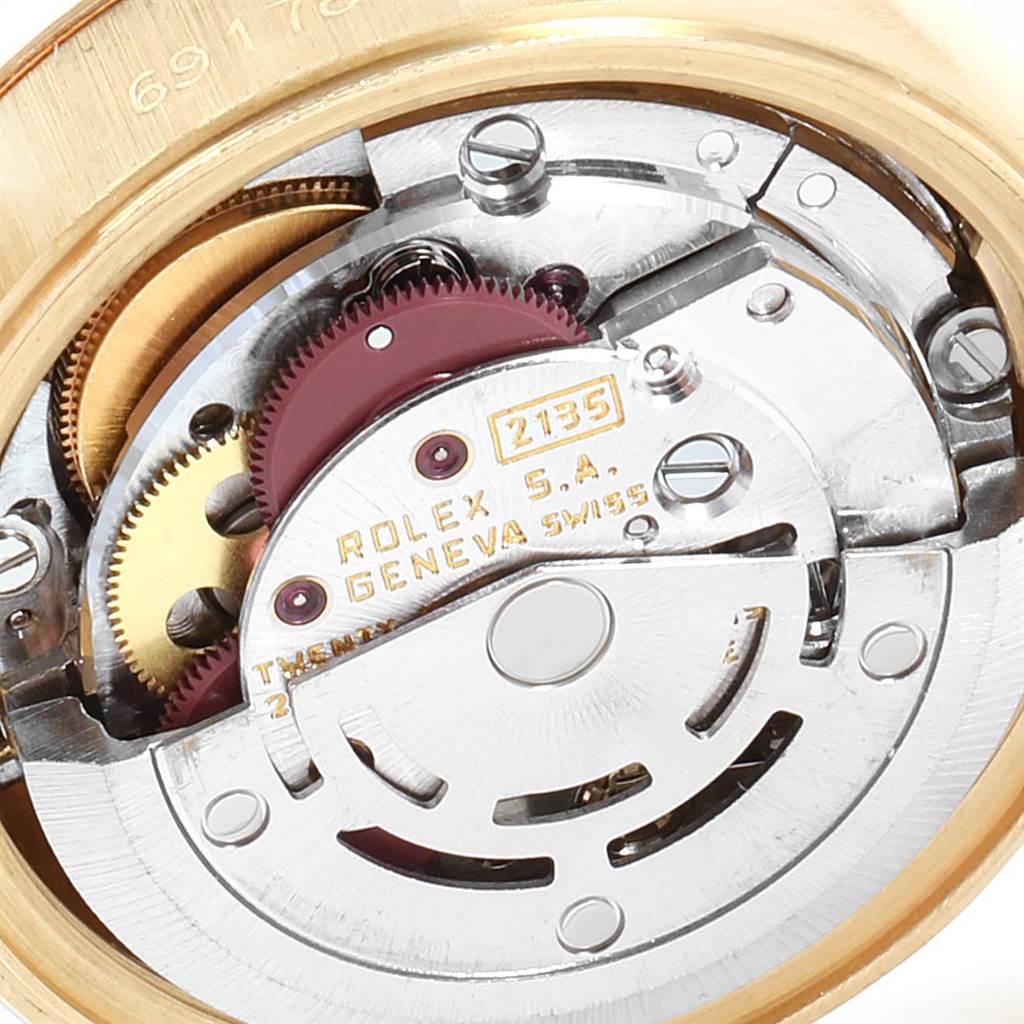 The image shows the inner mechanical movement of a Rolex President 69178 Women
s Yellow Gold Champagne Dial 69178 Women
s Yellow Gold Champagne Dial model watch from a close-up angle.