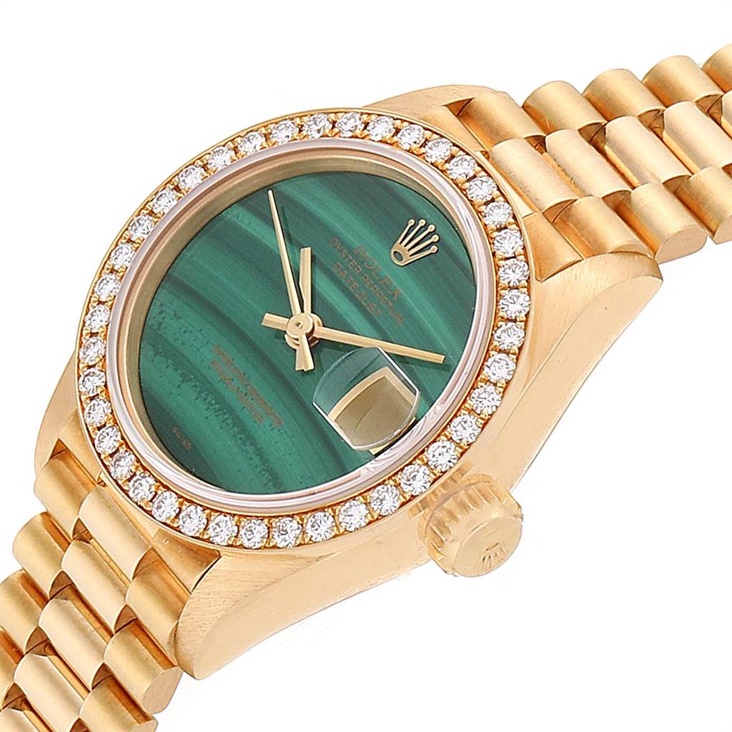 The image shows a close-up angled view of the face, bezel, and part of the bracelet of a Rolex President 69138 Women's Yellow Gold Green Dial 69138 Women's Yellow Gold Green Dial watch.