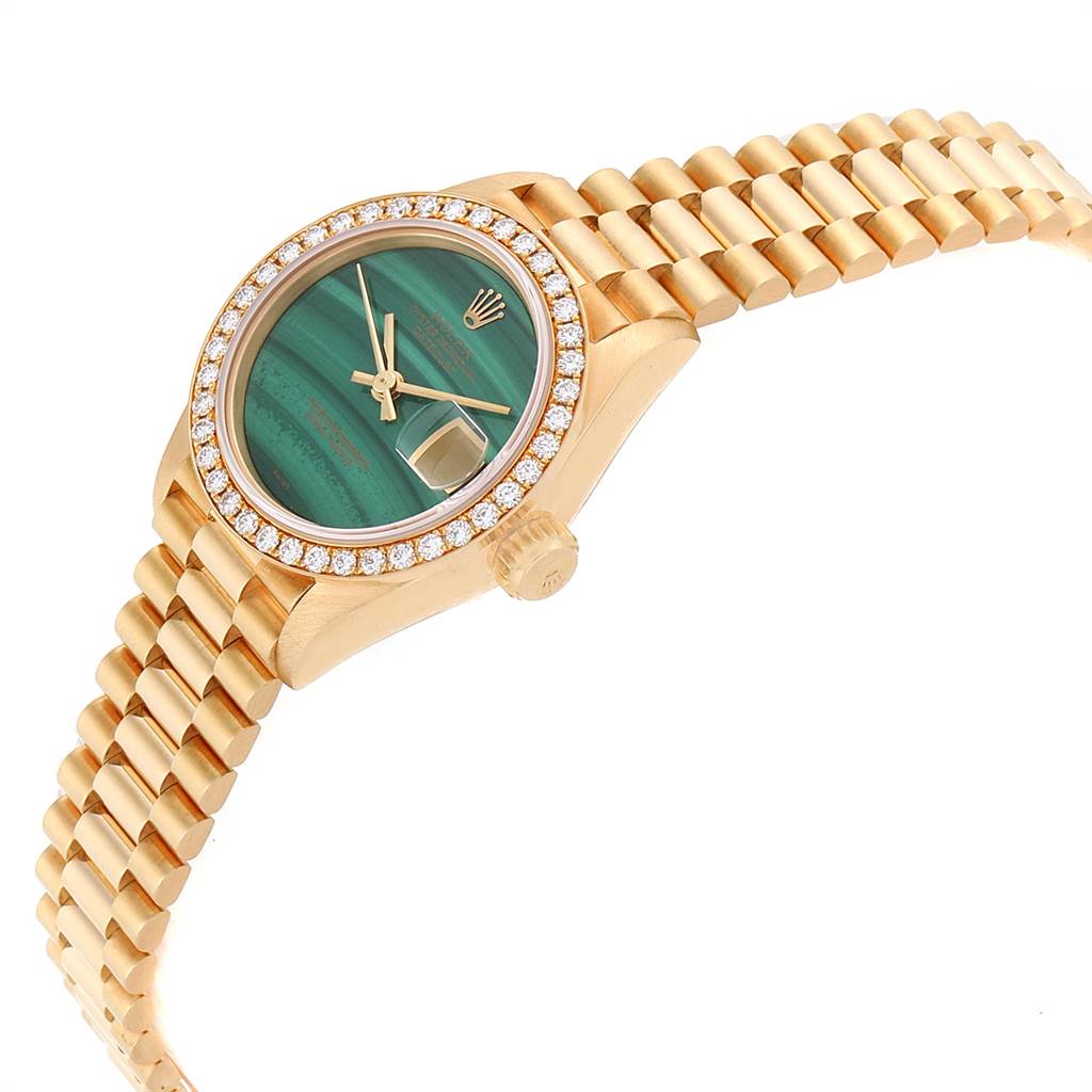 The image shows a Rolex President 69138 Women's Yellow Gold Green Dial 69138 Women's Yellow Gold Green Dial model watch, featuring the dial, bezel, crown, and part of the bracelet, viewed from an angled perspective.