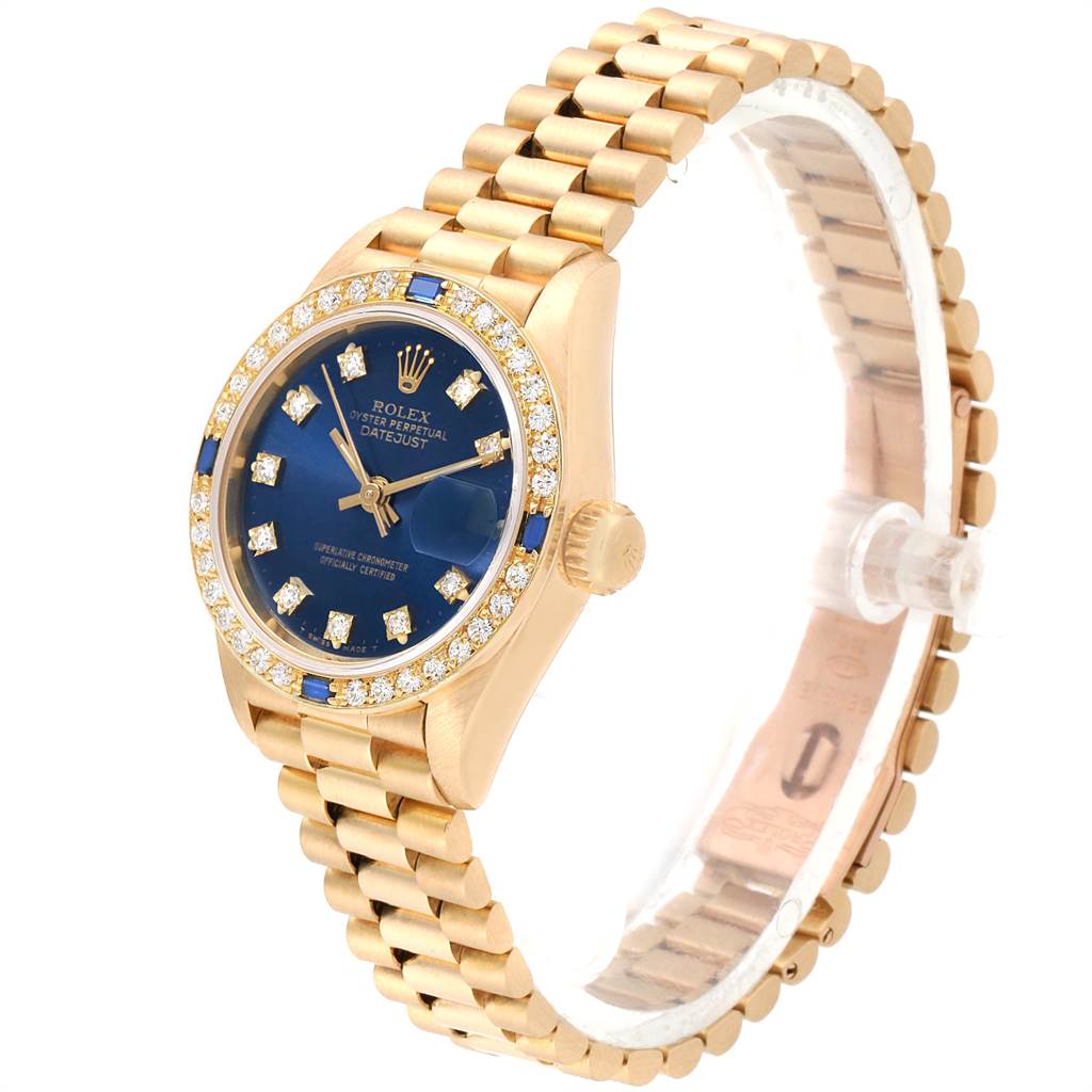 This image shows a side-angle view of a Rolex President 69088 Women's Yellow Gold Blue Dial 69088 Women's Yellow Gold Blue Dial model watch, featuring its blue dial, gold bezel, and bracelet.