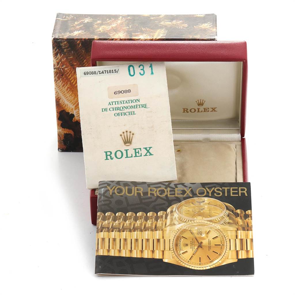 The image shows a Rolex President 69088 Women's Yellow Gold Blue Dial 69088 Women's Yellow Gold Blue Dial model watch's box, warranty certificate, and user manual from a front-facing angle.