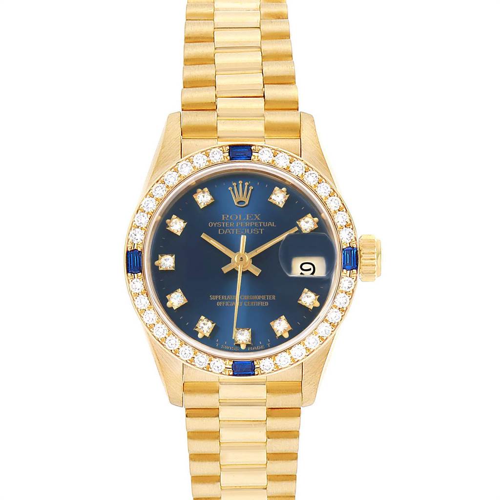 The image shows a Rolex President 69088 Women's Yellow Gold Blue Dial 69088 Women's Yellow Gold Blue Dial model watch with a gold band, diamond bezel, blue dial, and date window.