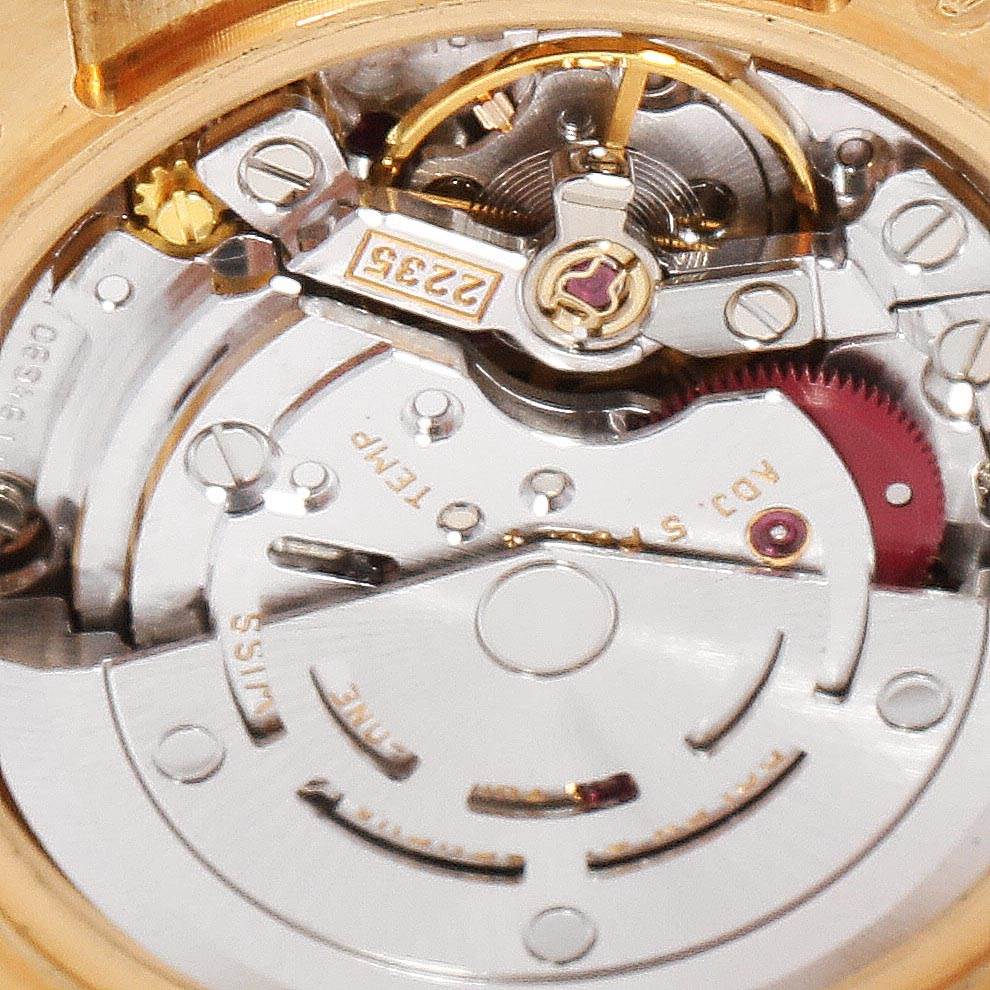 This close-up image shows the intricate mechanical movement of a Rolex President 179168 Women
s Yellow Gold Champagne Dial 179168 Women
s Yellow Gold Champagne Dial model watch.