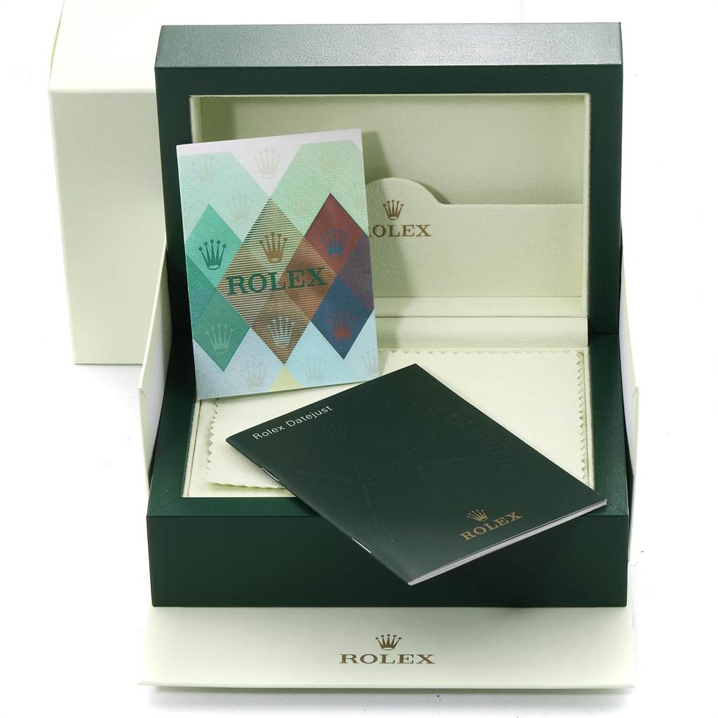 The image shows the packaging and accessories of a Rolex President 179168 Women
s Yellow Gold Champagne Dial 179168 Women
s Yellow Gold Champagne Dial model, including the box, booklets, and brochures.