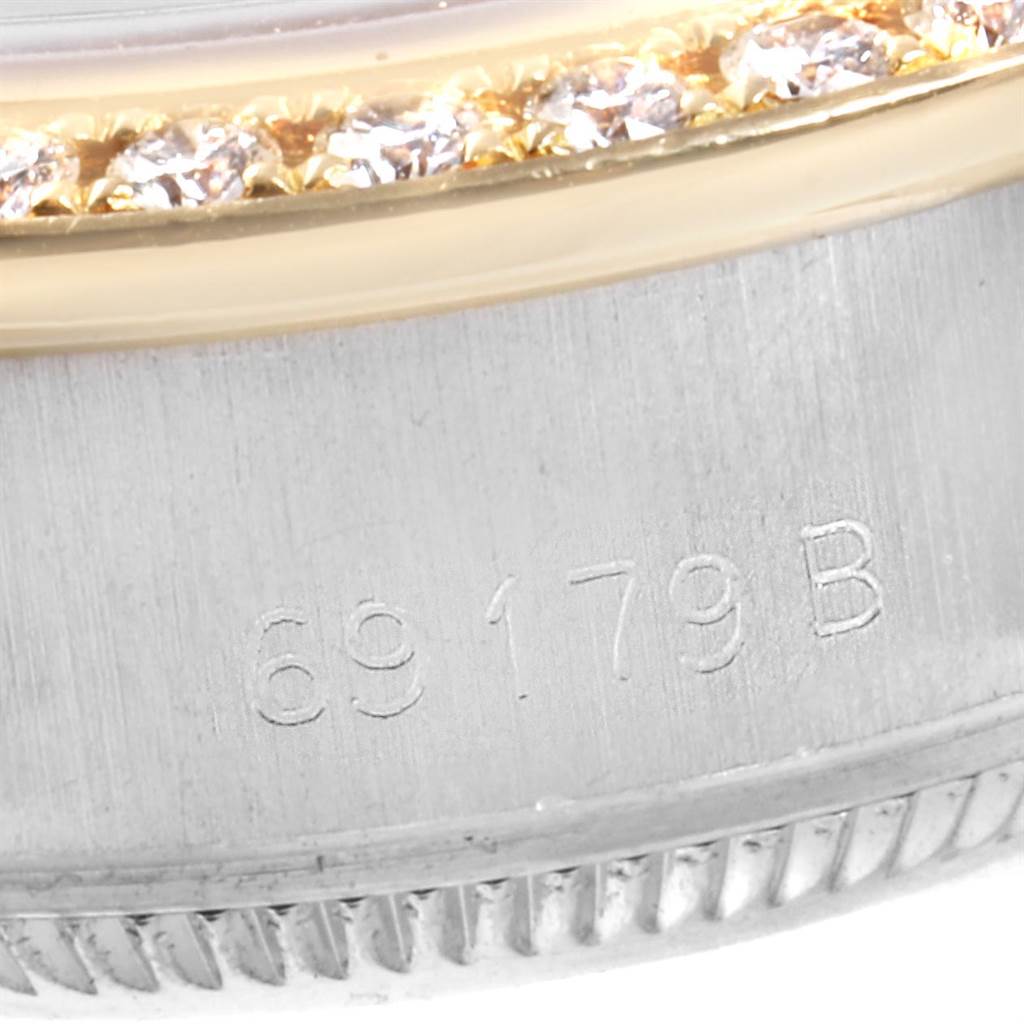 This close-up image shows the bezel and edge of the case of a Rolex President 69179 Women's White Gold Black Dial 69179 Women's White Gold Black Dial model watch with the reference number 69179B.
