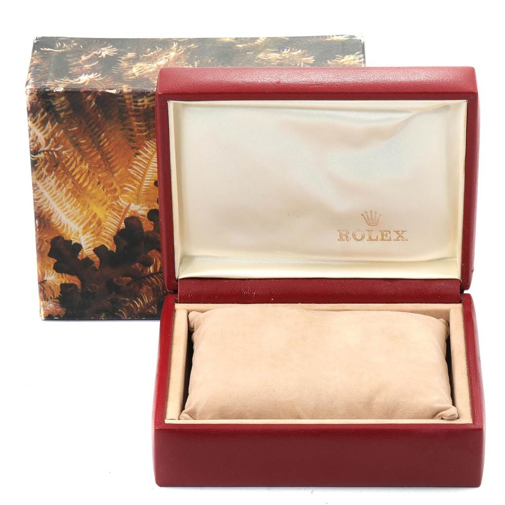 This image shows a red and beige Rolex President 69179 Women's White Gold Black Dial 69179 Women's White Gold Black Dial model watch box with the lid open.