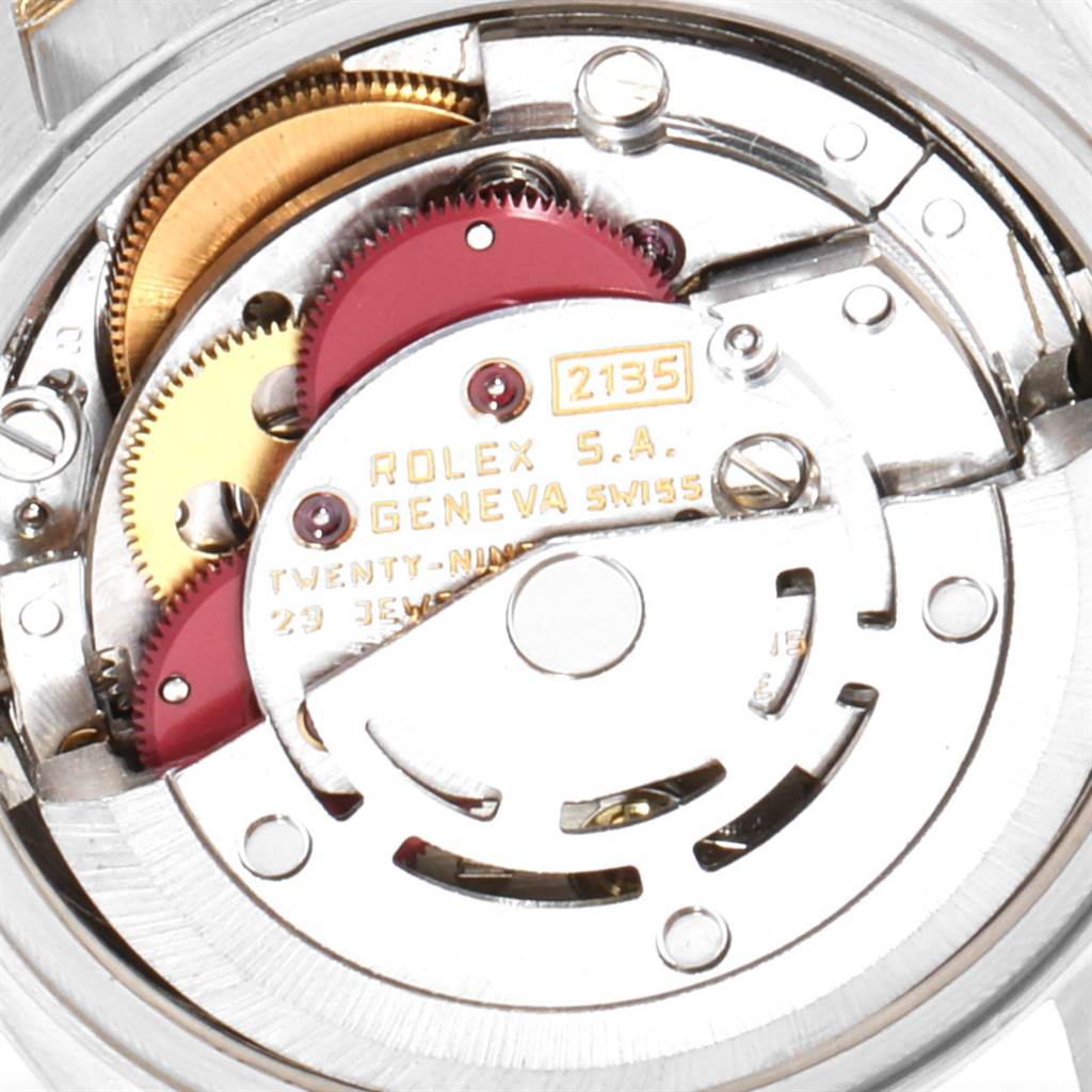 This image shows the interior mechanism of a Rolex President 69179 Women's White Gold Black Dial 69179 Women's White Gold Black Dial model, displaying gears and the movement components.
