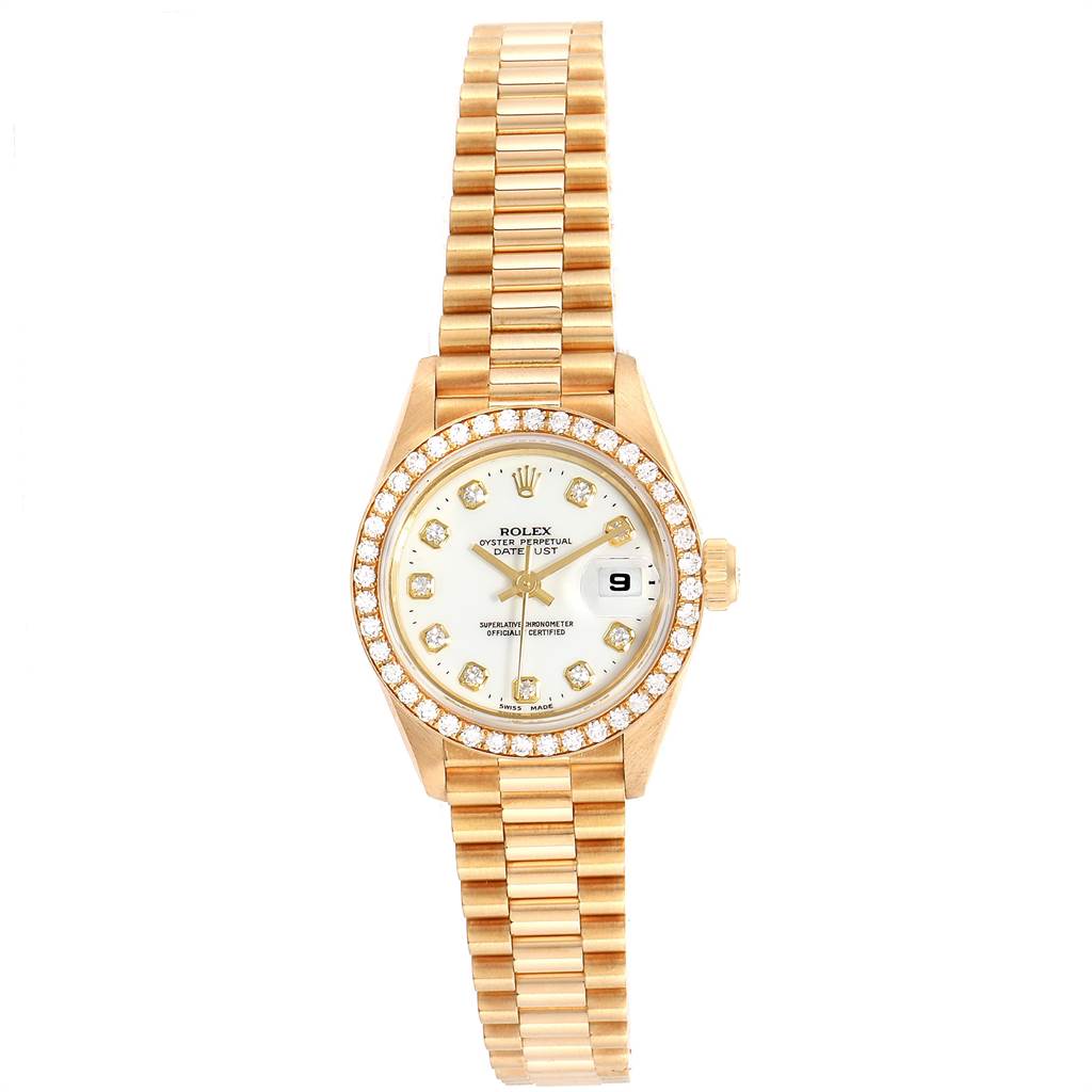 The Rolex President 69138 Women
s Yellow Gold White Dial 69138 Women
s Yellow Gold White Dial watch is shown from a top-down angle, displaying its gold case, diamond bezel, dial, and bracelet.