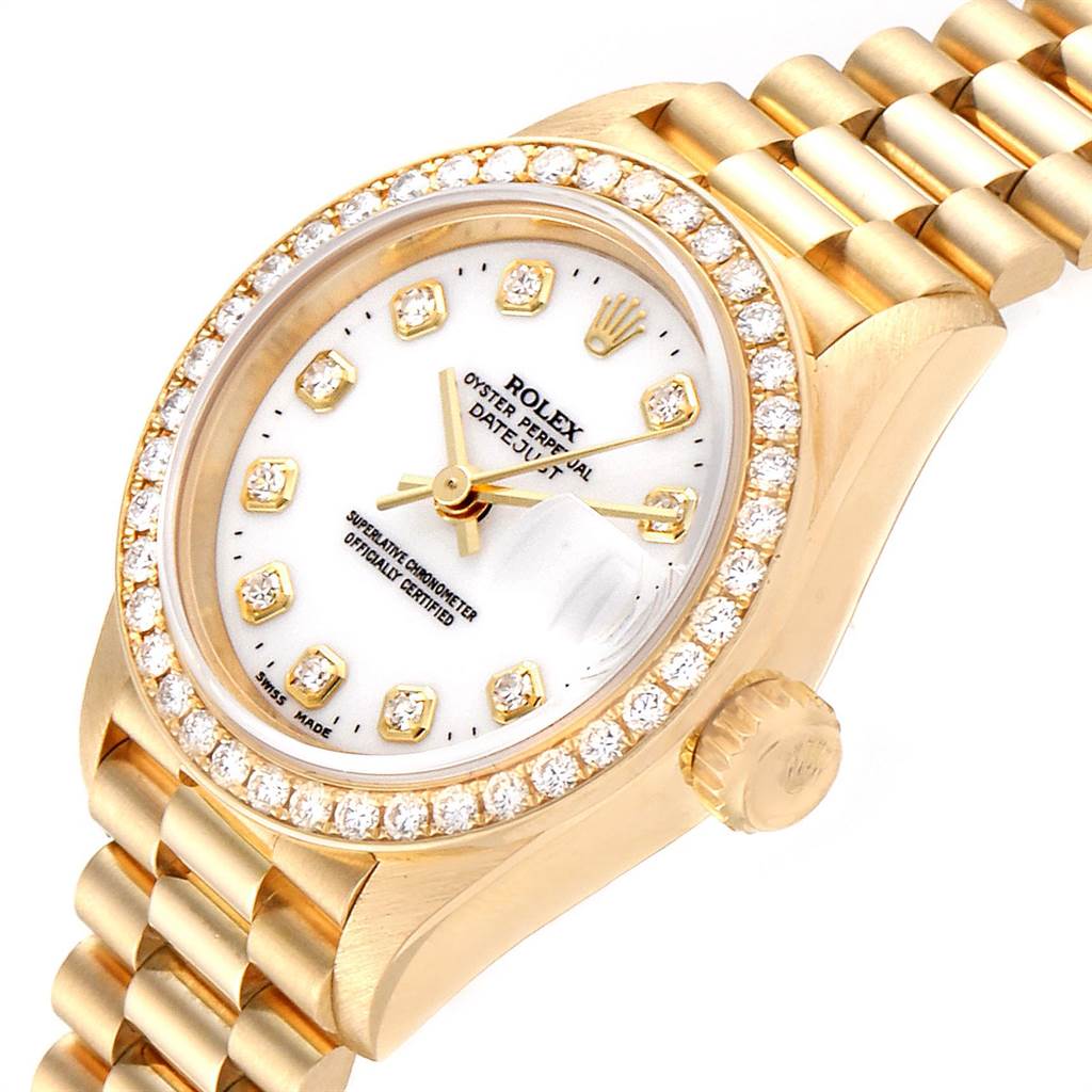 The image shows a close-up angle of a Rolex President 69138 Women
s Yellow Gold White Dial 69138 Women
s Yellow Gold White Dial model watch, highlighting its diamond bezel, dial, and bracelet.