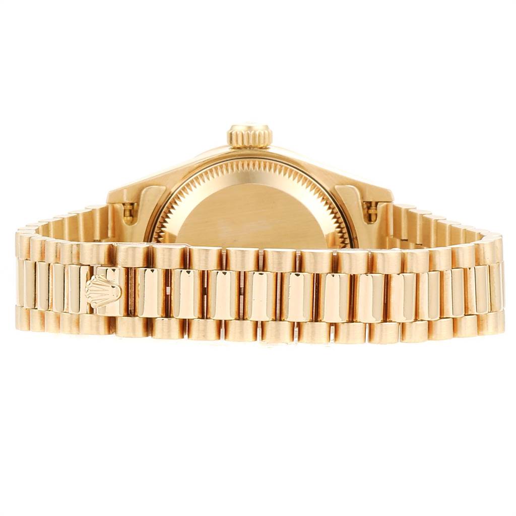 The image shows the back view of the Rolex President 69138 Women
s Yellow Gold White Dial 69138 Women
s Yellow Gold White Dial model watch, including the case back and bracelet.