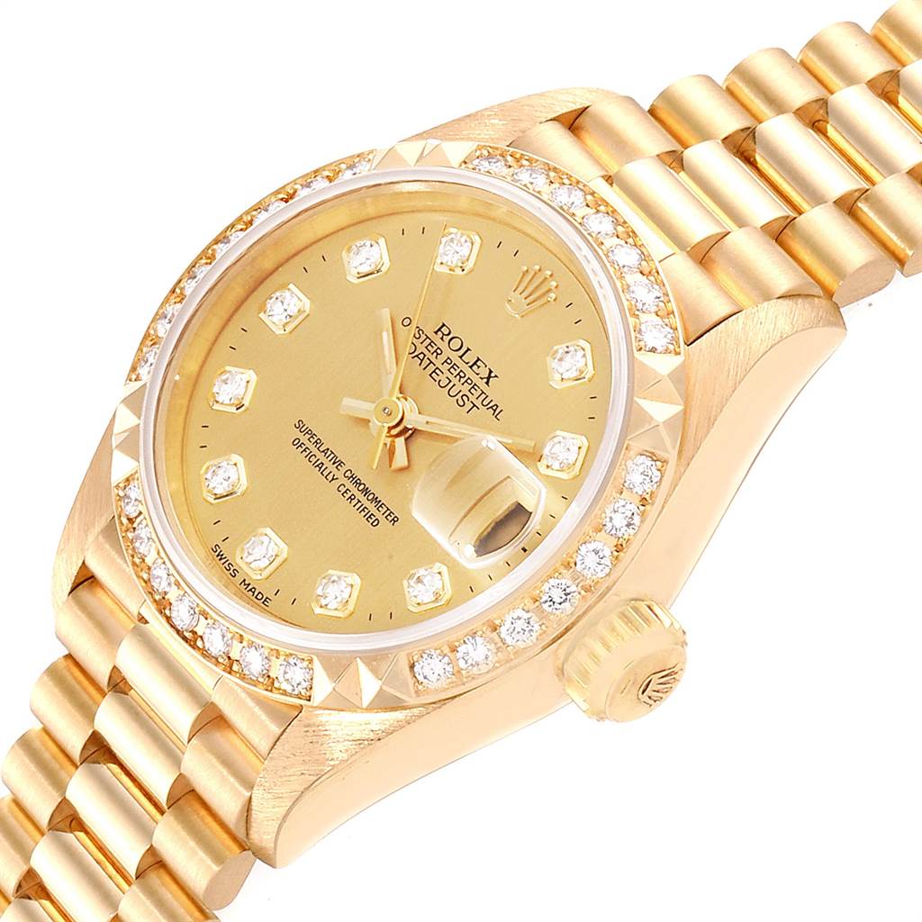 The image shows a close-up angle of a Rolex President 69268 Women
s Yellow Gold Champagne Dial 69268 Women
s Yellow Gold Champagne Dial watch, highlighting its dial, crown, bezel, and part of the bracelet.