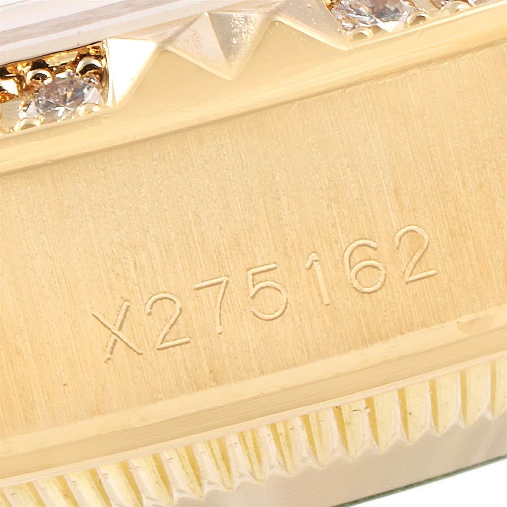 A close-up view of the Rolex President 69268 Women
s Yellow Gold Champagne Dial 69268 Women
s Yellow Gold Champagne Dial model showing the side case with its reference number and part of the diamond-studded bezel.