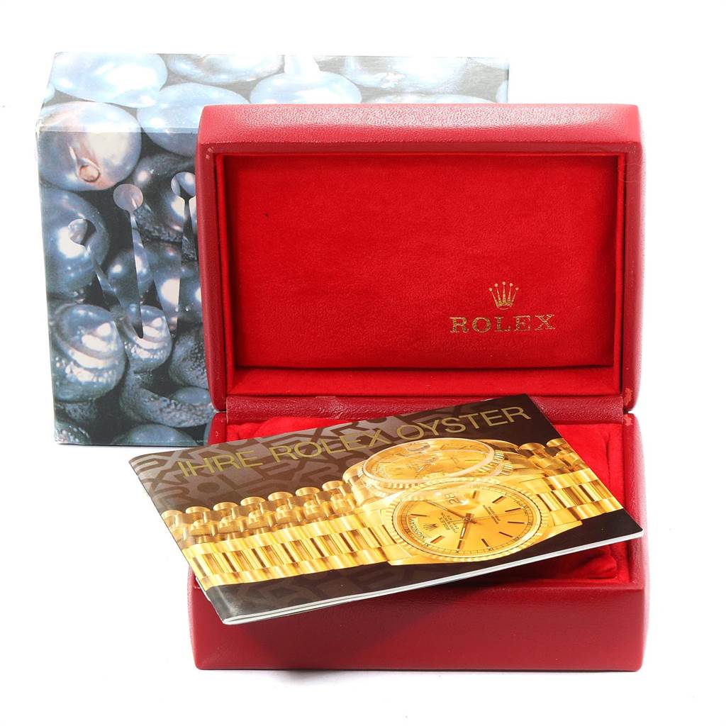 The image shows the Rolex President 69268 Women
s Yellow Gold Champagne Dial 69268 Women
s Yellow Gold Champagne Dial model watch
s box and a brochure, viewed from the front and slightly above.