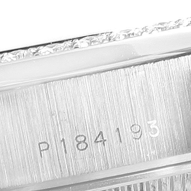 This close-up image displays the serial number engraving on the case side of a Rolex President 79179 Women's White Gold Black Dial 79179 Women's White Gold Black Dial model watch.