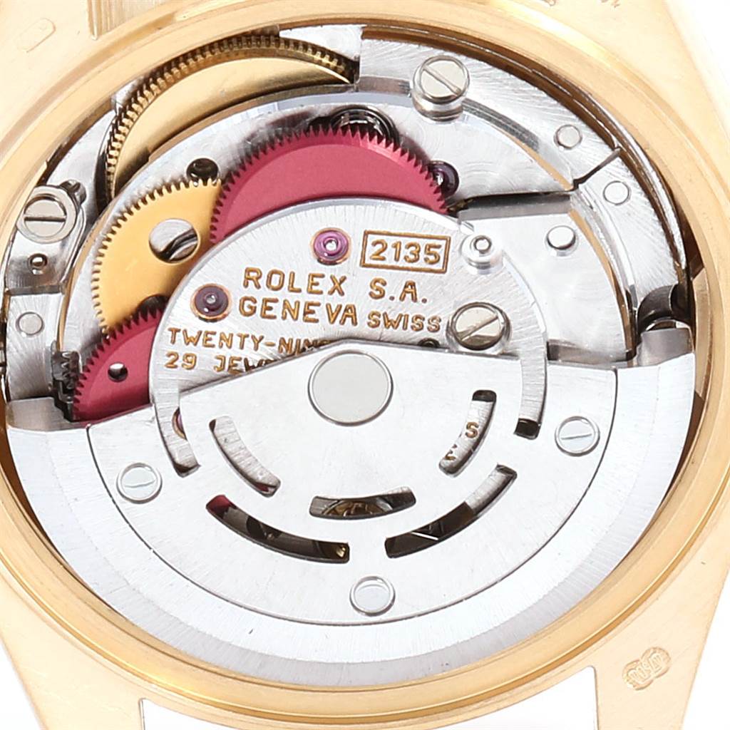 This image shows the movement mechanism of a Rolex President 69178 Women's Yellow Gold Champagne Dial 69178 Women's Yellow Gold Champagne Dial model watch, including gears and inscriptions.