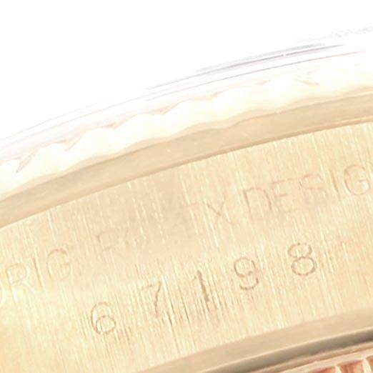 This image shows a close-up of the side engraving on the bezel of a Rolex President 67198 Women's Yellow Gold Black Dial 67198 Women's Yellow Gold Black Dial model watch.