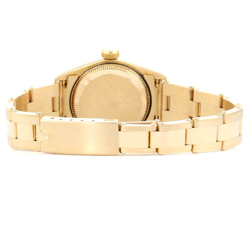 This image shows the back view of a Rolex President 67198 Women's Yellow Gold Black Dial 67198 Women's Yellow Gold Black Dial model watch, highlighting its bracelet and clasp.