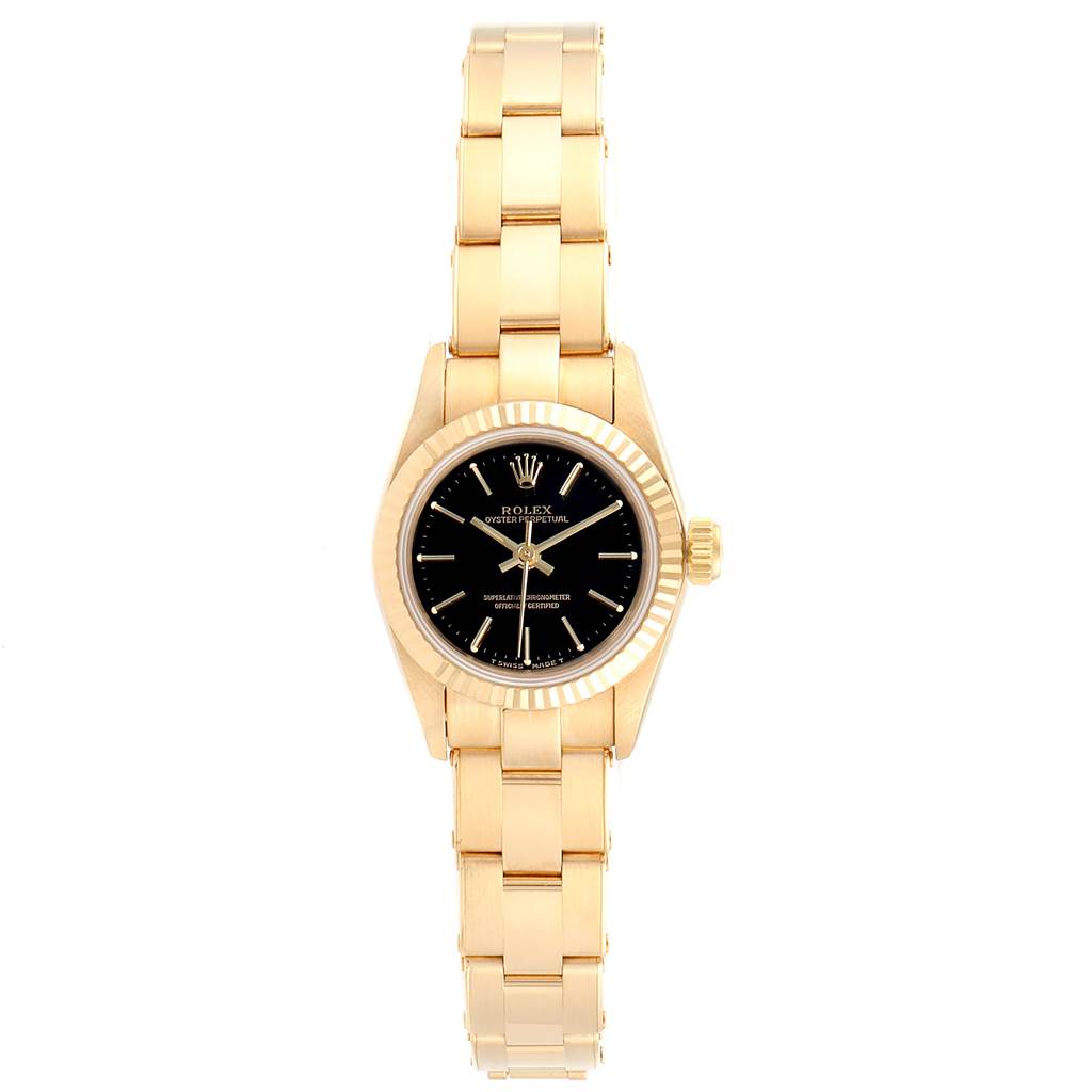 This image shows a Rolex President 67198 Women's Yellow Gold Black Dial 67198 Women's Yellow Gold Black Dial model watch from a top-down angle, displaying its gold bracelet, black dial, and fluted bezel.