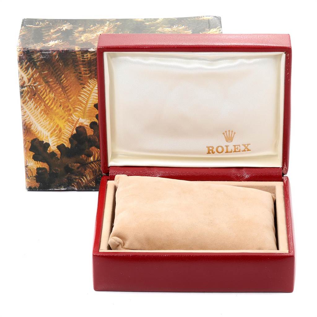 The image shows the open box and pillow for a Rolex President 69178 Women's Yellow Gold White Dial 69178 Women's Yellow Gold White Dial model watch, showcasing the brand's logo inside.