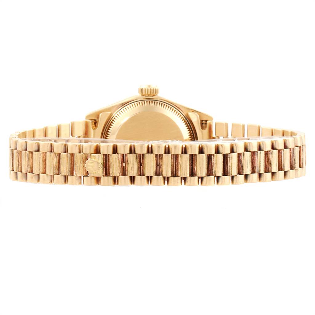 The image shows the rear view of the Rolex President 69278 Women's Yellow Gold Blue Dial 69278 Women's Yellow Gold Blue Dial model, highlighting its gold bracelet and clasp.